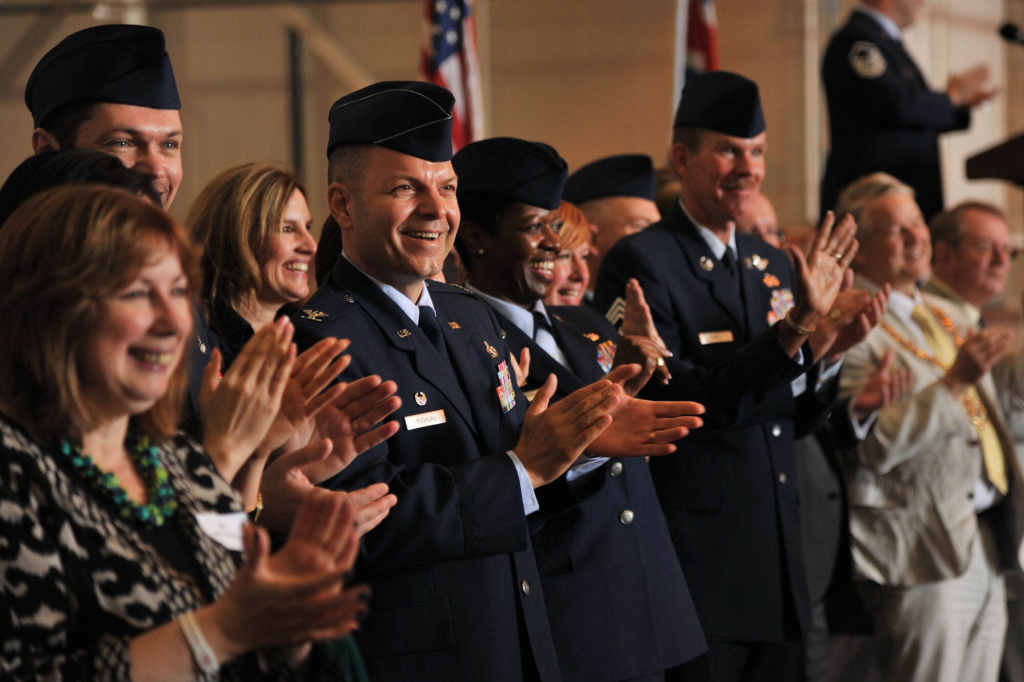 RAF Mildenhall, England - Leadership from RAFs Mildenhall, Lakenheath and Feltwell and community leaders, cheer on athletes during the traditional torch relay parade of champions at Joan Mann Special Sports Day here Sept. 24, 2011. This year marks the 30th anniversary of the event. (U.S. Air Force photo by Senior Airman Jerilyn Quintanilla)