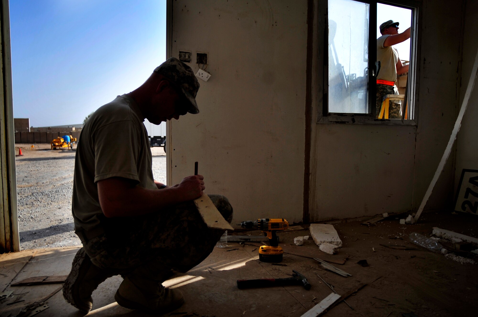 Staff Sgt. Matt Tones, 389th Engineer Brigade, performs carpentry work on a guard shack at Ali Base, Iraq, on Aug. 31, 2011. Airmen and soldiers work closely together to help transition equipment and buildings to Iraqi government.  Tones is deployed from Middletown Reserve Center in Middletown, Iowa, and is from Davenport, Iowa.  (U. S. Air Force photo/Master Sgt. Cecilio Ricardo)