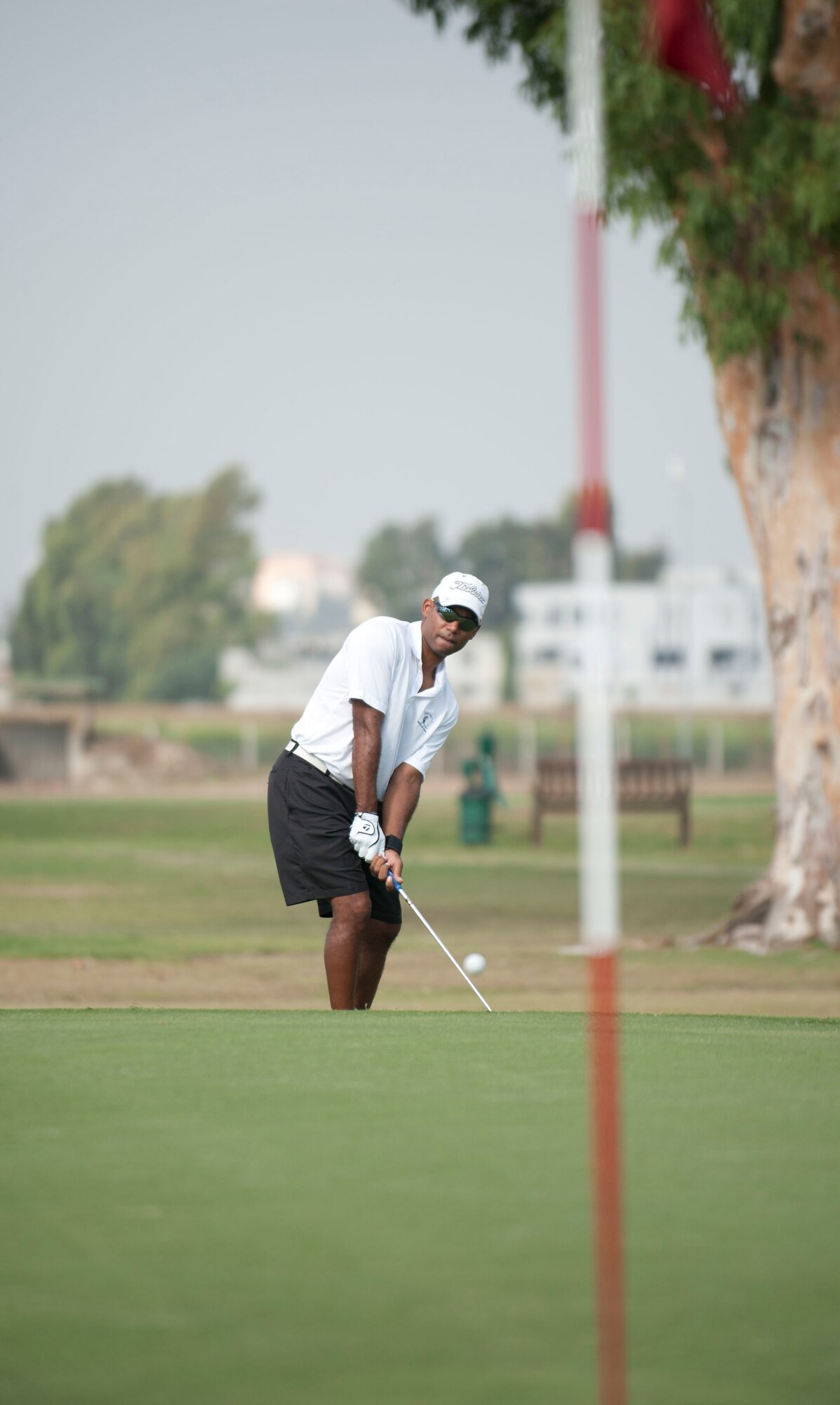 Darrell Wagner, 39th Logistics Readiness Squadron, attempts to wedge a ball during the Club Championship Sept. 24, 2011, at the Hodja Lakes Golf Course, Incirlik Air Base, Turkey. Thirty-one people competed in the championship. Ryan Stebbins, 39th Force Support Squadron, won with a score of 154. (U.S. Air Force photo by Senior Airman Clayton Lenhardt/Released)