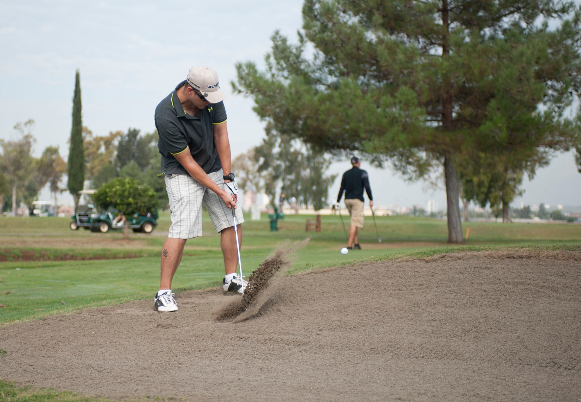 Eric Hamp, 39th Communications Squadron, hits a ball out of a sand trap during the Club Championship Sept. 24, 2011, at the Hodja Lakes Golf Course, Incirlik Air Base, Turkey. Thirty-one people competed in the championship. Ryan Stebbins, 39th Force Support Squadron, won with a score of 154. (U.S. Air Force photo by Senior Airman Clayton Lenhardt/Released)