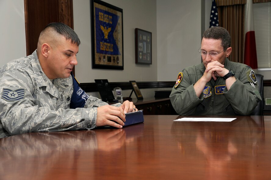 MISAWA AIR BASE, Japan - Tech. Sgt. Jason Kidd, left, 35th Security Forces Squadron, talks with Col. Michael D. Rothstein, 35th Fighter Wing commander, about the benefits of becoming an Air Force Sergeants Association member here 27 Sept. AFSA is a leading force on Capitol Hill and works closely with elected representatives and their staff members to assist in drafting proposals for legislation on issues related to military members and their families. AFSA also works closely with White House staff personnel and Pentagon officials to ensure that enlisted members' concerns are heard and acted upon. The mission of AFSA is to support and improve the quality of life, economic situation and well-being of Air Force enlisted personnel and their families. Rothstein is the first 35th Fighter Wing commander to join AFSA. (U.S. Air Force photo/Tech. Sgt. Marie Brown)