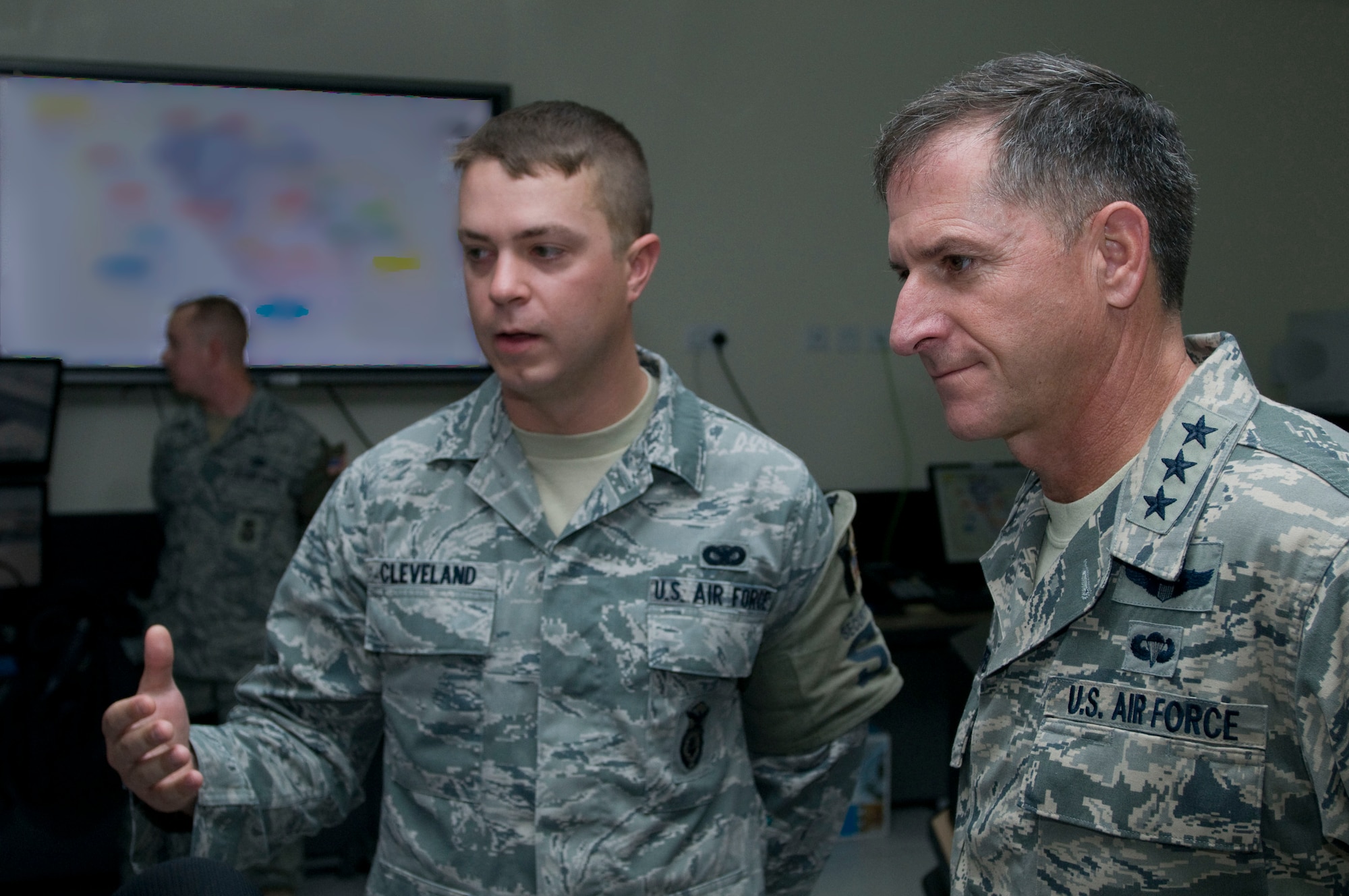 Lt. Gen. David Goldfein, U.S. Air Forces Central Command commander, receives a briefing about security forces operations from Airman 1st Class Shawn Cleveland, 379th Expeditionary Security Forces Squadron alarm monitor, Sept. 17, 2011, at an undisclosed location in Southwest Asia.  Cleveland, a native of Lamarque, Texas, is deployed from Patrick Air Force Base, Fla. (U.S. Air Force illustration/Senior Airman Eric Summers Jr.)