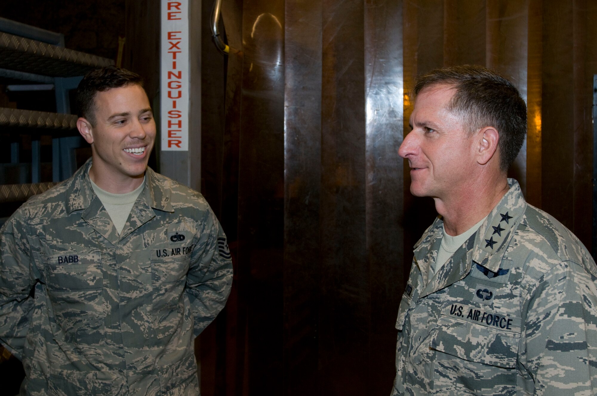 Tech. Sgt. Kenneth Babb, 379th Expeditionary Maintenance Squadron, discusses metalworking and welding with Lt. Gen. David Goldfein, U.S. Air Forces Central Command commander, during the general’s tour of the 379th Air Expeditionary Wing Sept. 17, 2011. Babb, a native of Fairhope, Ala., is deployed from Ellsworth Air Force Base, S.D. (U.S. Air Force photo/Senior Airman Eric Summers Jr.)
