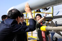 KUNSAN AIR BASE, Republic of Korea -- A member of the Republic of Korea Air Force briefs Wonkwang University Medical Center and Gunsan Medical Center executive leadership teams about their KF-16 Fighting Falcons here Sept 24. Wonkwang University and Gunsan Medical Centers leadership teams were invited by the 8th Medical Group commander and leadership to tour the base. The Wonkwang University and Gunsan Medical Centers are Kunsan AB’s referral hospitals of choice nearby who provide specialty care to Wolf Pack members when it is not available at the 8th MDG clinic. (U.S. Air Force photo/Staff Sgt. Rasheen A. Douglas)