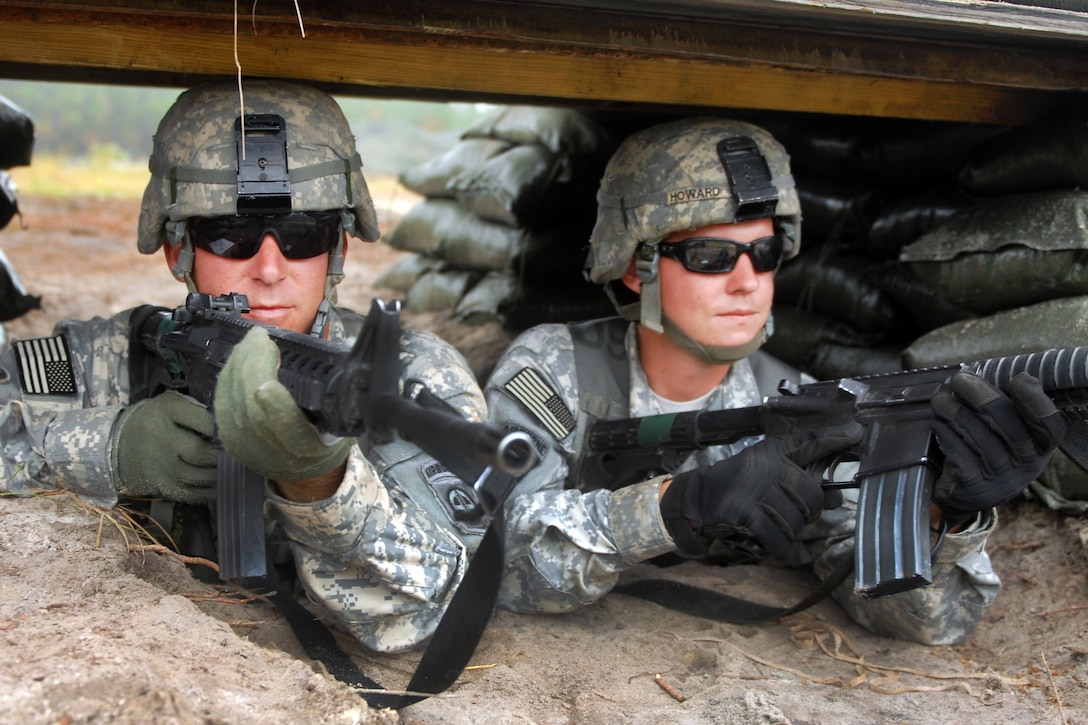 Army Sgt. Lawrance Teza, left, and Spc. R. Travis Howard, perform guard ...