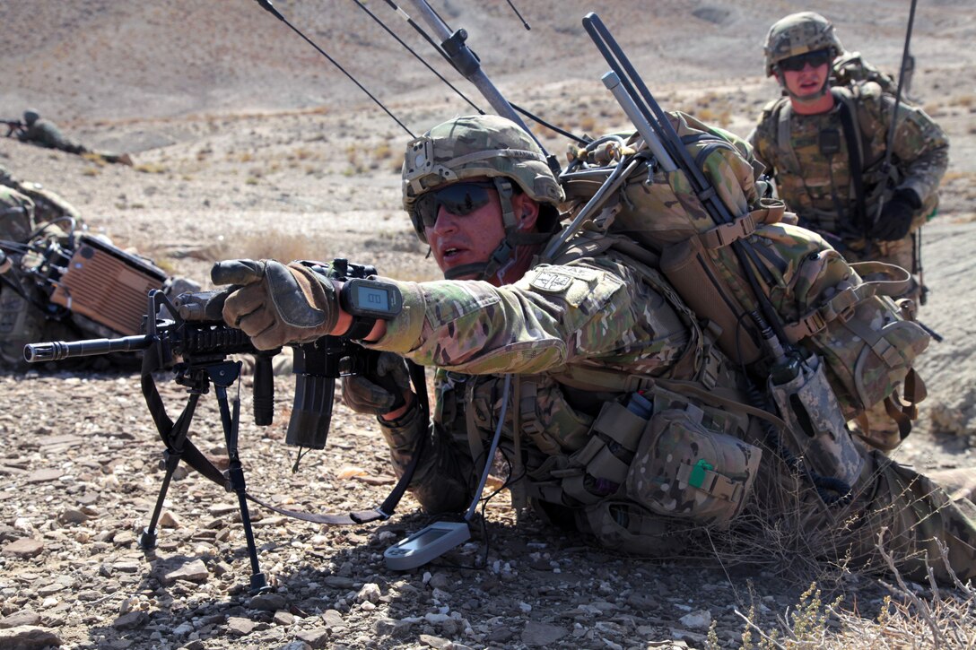 U.S. Army Staff Sgt. James Wardle, front, and 2nd Lt. Raymond Vetter provide security during a patrol outside Forward Operating Base Curry in Paktika province, Afghanistan, Sept. 20, 2011. Wardle and Vetter are assigned to Company B, 172nd Infantry Brigade.