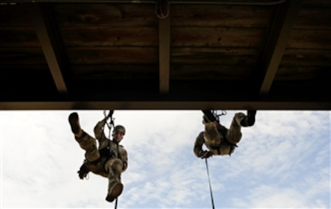 U.S. Air Force Senior Airman Adam Azar, left, and Staff Sgt. Ryan Cloudier, take part in a rappelling training course at Hurlburt Field, Fla., on Sept. 20, 2011.  Azar and Cloudier are Air Force pararescuemen assigned to the Red Team of the 23rd Special Tactics Squadron.  