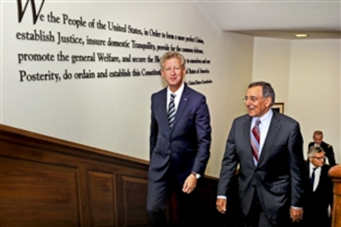 U.S. Defense Secretary Leon E. Panetta, right, escorts Belgian Defense Minister Pieter De Crem to a conference room at the Pentagon, Sept. 27, 2011.  The two defense leaders participated in bilateral security discussions on a broad range of issues.  