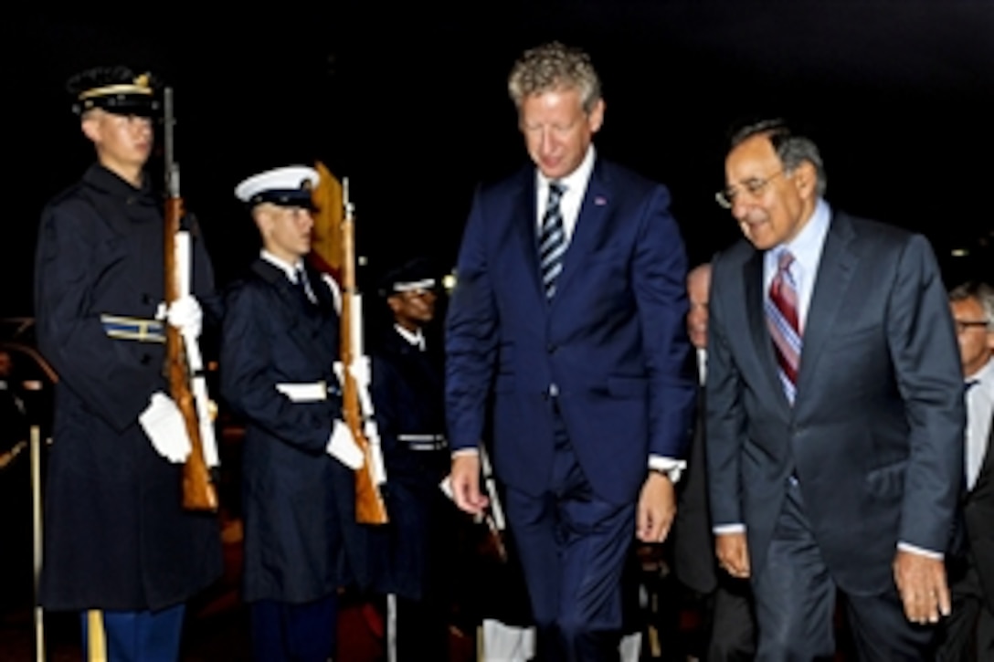 U.S. Defense Secretary Leon E. Panetta, right, escorts Belgian Defense Minister Pieter De Crem through an honor cordon for a meeting at the Pentagon, Sept. 27, 2011. The two defense leaders discussed a broad range of bilateral security issues.