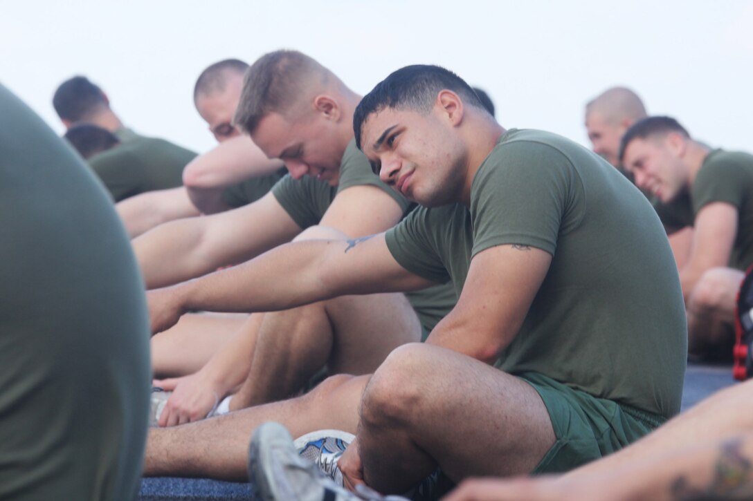 Sgt. Jason Lasalle, radio operator, Combat Logistics Battalion 22 (CLB), 22nd Marine Expeditionary Unit, and native of Philadelphia, stretches for physical training aboard amphibious transport dock USS Mesa Verde (LPD 19), Sept. 27, 2011.  CLB conducts biweekly battalion training to combat complacency during deployment. The Marines and sailors of the 22nd MEU are currently deployed with Amphibious Squadron 6 (PHIBRON 6) aboard the USS Bataan Amphibious Ready Group (BATARG) and will continue to train and improve the MEU’s ability to operate as a cohesive and effective Marine Air Ground Task Force.  The 22nd MEU is a multi-mission, capable force, comprised of an Aviation Combat Element, Marine Medium Tilt Rotor Squadron 263 (Reinforced)(VMM-263 (REIN)); a Logistics Combat Element, Combat Logistics Battalion 22(CLB 22); a Ground Combat Element, Battalion Landing Team, 2nd Battalion, 2nd Marine Regiment(BLT 2/2) and its Command Element.
