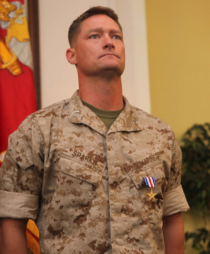 Captain Timothy R. Sparks, former company commander, 1st Battalion, 6th Marine Regiment, 2nd Marine Division, stands at the position of attention while his citation is read after receiving a Silver Star from Brig. Gen. W. Lee. Miller Jr., the acting commanding general of 2nd Marine Division, aboard Marine Corps Base Camp Lejeune N.C., September 28. The Silver Star is the nation’s third highest award for combat valor and was presented to Sparks for his actions during his deployment to Helmand Province, Afghanistan in 2010.