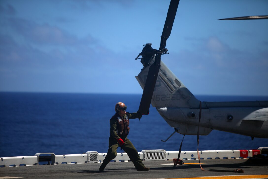 A Marine with Marine Medium Helicopter Squadron 265 (Reinforced), secures the tail rotor of an AH-1W Cobra helicopter, Sept. 28. The squadron flew onto USS Essex (LHD 2), joining the MEU for the deployment and upcoming certification exercises around Okinawa. The 31st MEU is the only continually forward-deployed MEU, and remains the nation’s force-in-readiness in the Asia-Pacific region.