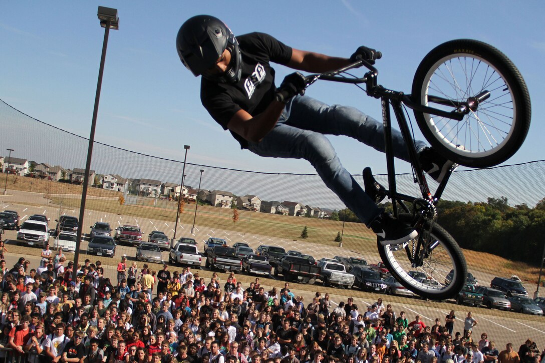 BMX biker Austin Coleman performs a trick in front of hundreds of students at Shakopee High School during the 2011 ASA Fall High School Tour Sept. 28. The tour is an interactive “extreme” sports show that visits high schools throughout the United States with several of the world’s top professional skateboarders, BMX bikers and inline skaters performing demonstrations on a state-of-the-art pro half-pipe, while an emcee delivers the anti-tobacco message. For additional imagery from the event, visit www.facebook.com/rstwincities.