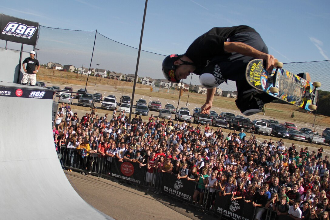 Inline skater Eito Yasutoko watches skateboarder Josh Stafford perform a trick during the Shakopee, Minn., stop of the 2011 ASA Fall High School Tour Sept. 28. The tour is an interactive “extreme” sports show that visits high schools throughout the United States with several of the world’s top professional skateboarders, BMX bikers and inline skaters delivering an anti-tobacco message. For additional imagery from the event, visit www.facebook.com/rstwincities.