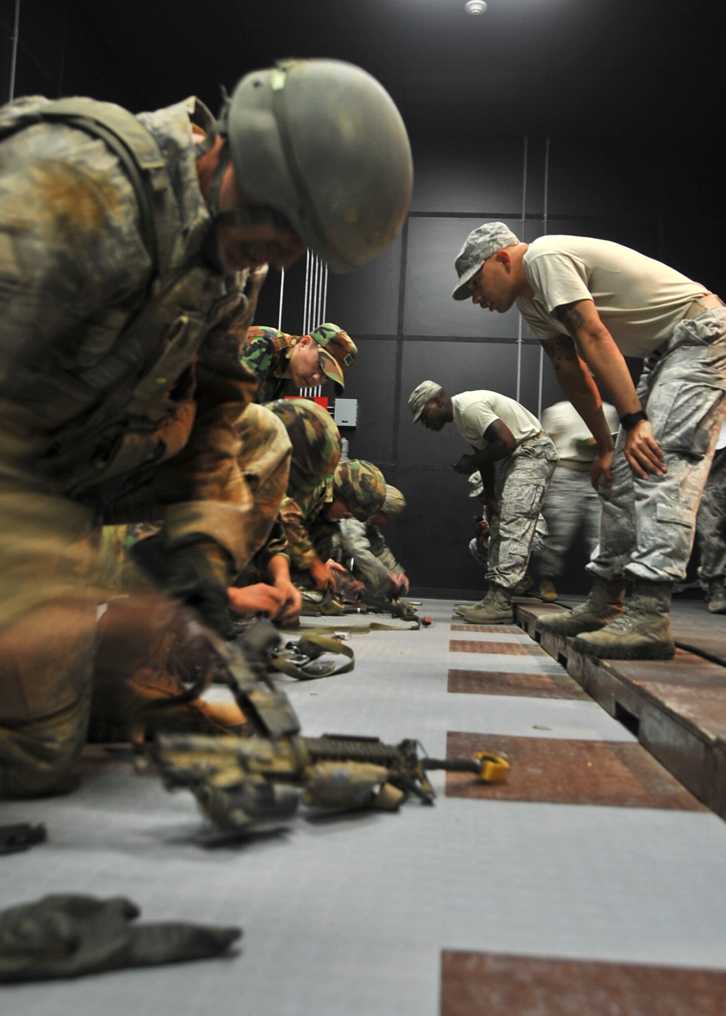 Members of the 51st Security Forces Squadron along with members of the Republic of Korea’s Air Police, compete during the weapons challenge portions of the confidence course during their Combat Readiness Course Sept. 27, 2011. The Combat Readiness Course happens once a month and is offered to all new security forces members. (U.S. Air Force photo/Senior Airman Adam Grant)      