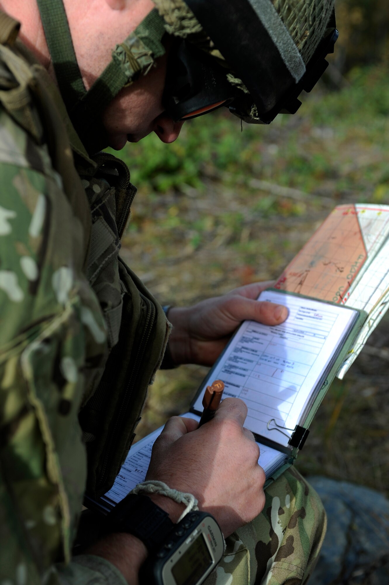 Corporal Gaz Edwards documents the coordinates of mock targets on a training airfield Sept. 9, 2011, at Eielson Air Force base, Alaska. Cpl. Edwards was taking part in a training exercise where joint terminal air controllers from the United Kingdom practiced controlling airstrikes from United States Air Force aircraft. Cpl. Edwards is a JTAC assigned to the 19th Regiment, Royal Artillery known as the Highland Gunners. (U.S. Air Force photo/ Senior Airman Willard E. Grande II)