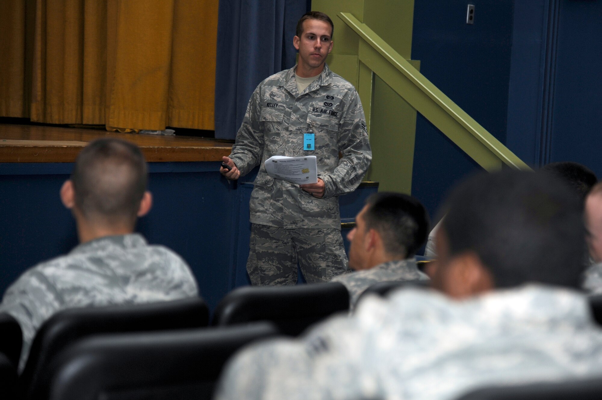 MISAWA AIR BASE, Japan - Airman 1st Class Shawn Kelley, center, 35th Civil Engineer Squadron, briefs role players during a 35th Fighter Wing initial reception briefing here Sept. 29. Misawa Air Base is currently going through an Initial Readiness Response Exercise designed to help prepare Airmen for their Operational Readiness Inspection in December. (U.S. Air Force photo/Tech. Sgt. Marie Brown)