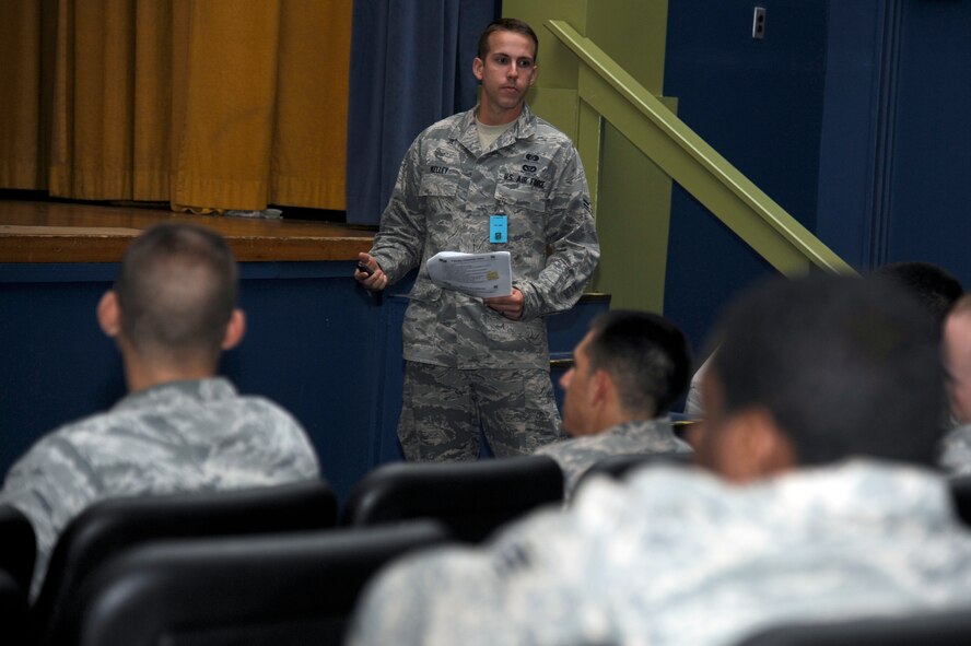 MISAWA AIR BASE, Japan - Airman 1st Class Shawn Kelley, center, 35th Civil Engineer Squadron, briefs role players during a 35th Fighter Wing initial reception briefing here Sept. 29. Misawa Air Base is currently going through an Initial Readiness Response Exercise designed to help prepare Airmen for their Operational Readiness Inspection in December. (U.S. Air Force photo/Tech. Sgt. Marie Brown)