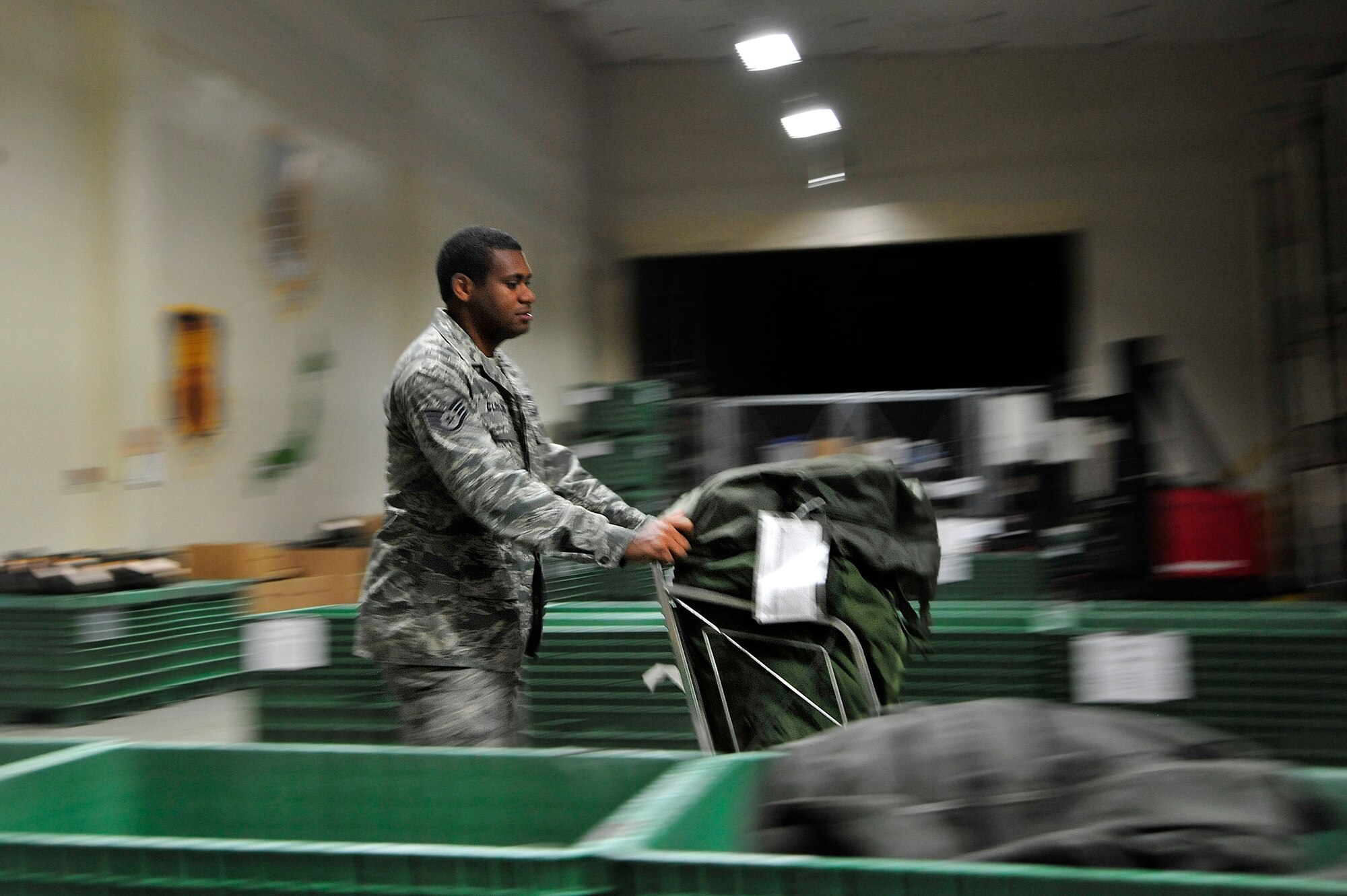 MISAWA AIR BASE, Japan – Staff Sgt. Phillip Cleveland, 35th Maintenance Squadron, gathers gear he’ll need for deployment during an initial readiness response exercise here Sept. 28. The purpose of the exercise is to test the 35th Fighter Wing’s ability to generate aircraft and deploy combat power anywhere they are asked to deploy to. (U.S. Air force photo/ Staff Sgt. Nathan Lipscomb)