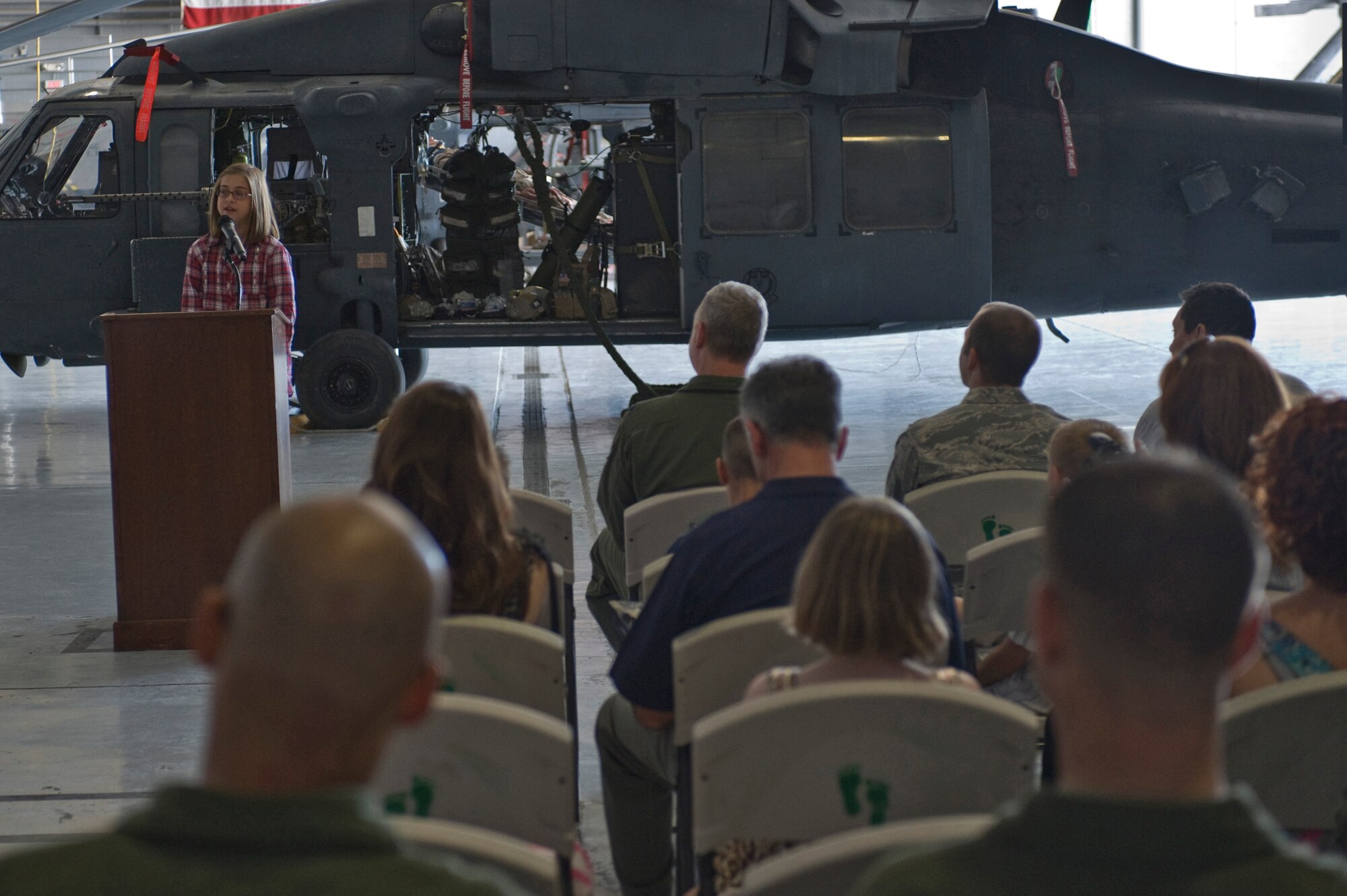 Gia Morris, 10, daughter of Steve Morris, speaks about the 66th Rescue Squadron and the "That Others May Live" foundation Sept. 24, 2011, at Nellis Air Force Base, Nev. The TOML foundation is a non-profit charitable organization that provides scholarships, family counseling and aid to surviving children of United States Air Force rescue Airmen who gave the ultimate sacrifice during a rescue mission, training or other personnel recovery mission. (U.S. Air Force photo by Airman 1st Class Matthew Lancaster/Released)