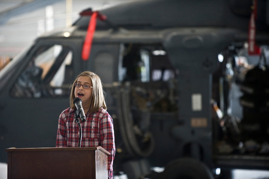 Gia Morris, 10, daughter of Steve Morris, speaks about the 66th Rescue Squadron and the "That Others May Live" foundation Sept. 24, 2011, at Nellis Air Force Base, Nev. The TOML foundation is a non-profit charitable organization that provides scholarships, family counseling and aid to surviving children of United States Air Force rescue Airmen who gave the ultimate sacrifice during a rescue mission, training or other personnel recovery mission. (U.S. Air Force photo by Airman 1st Class Matthew Lancaster/Released)