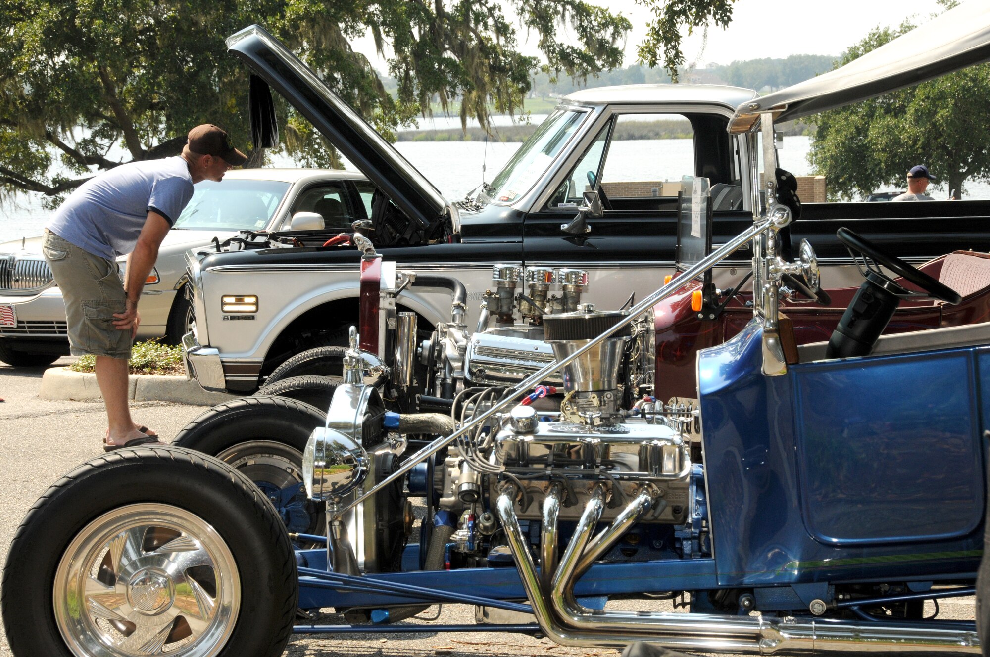 Navy Chief Brian Oelke from the Naval Construction Battalion Center in Gulfport inspects the engine on a 1972 Chevy C-10 at Cruisin’ Keesler at marina park Sept. 24. Saturday’s event was a prelude to the 15th annual Cruisin’ the Coast, Sunday through Oct. 9.  (U.S. Air Force photo by Kemberly Groue)