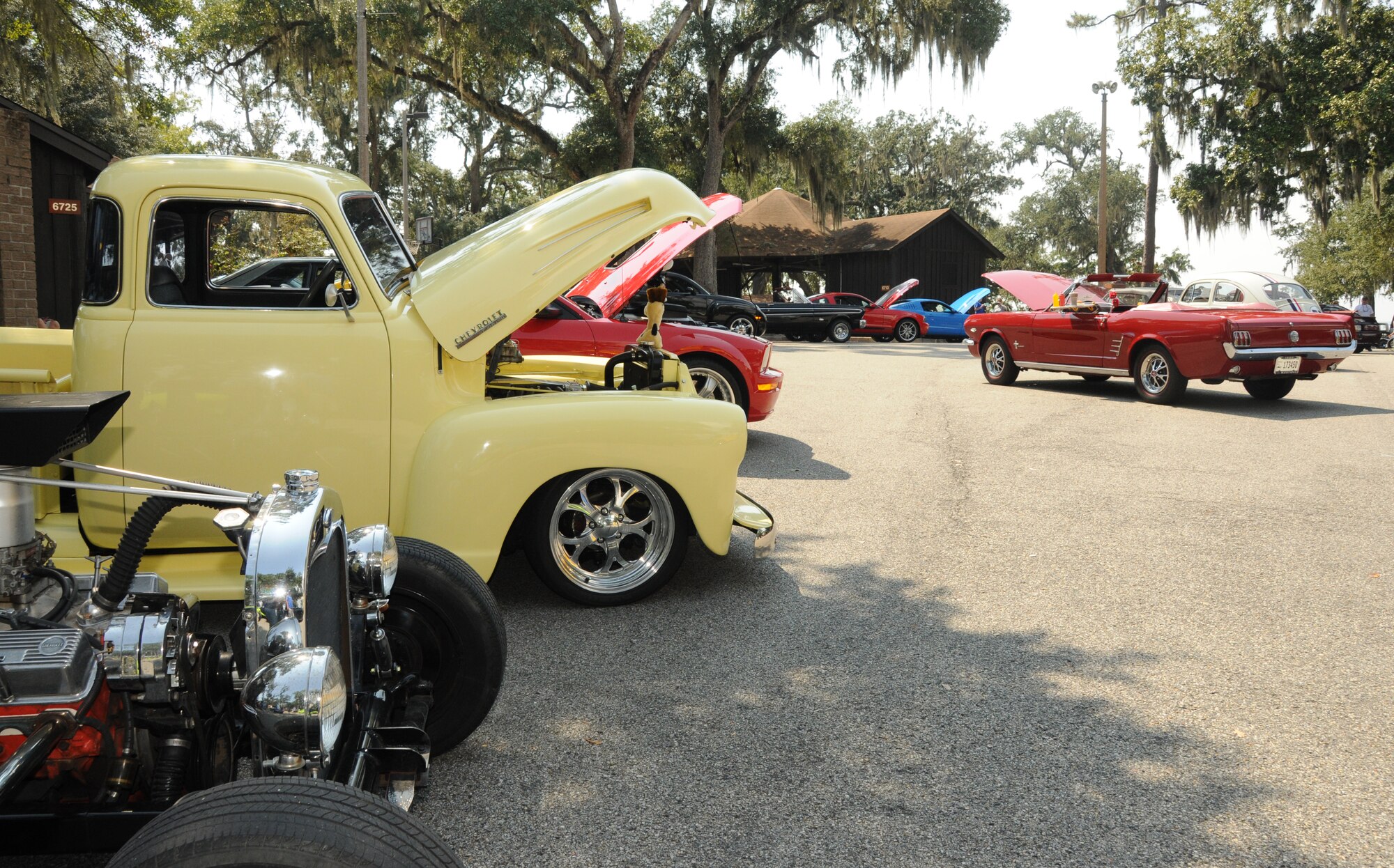 Along with their shiny exteriors, these vintage cars pop their hoods to show off the well-oiled machinery underneath at Cruisin’ Keesler at marina park Sept. 24.  (U.S. Air Force photo by Kemberly Groue)