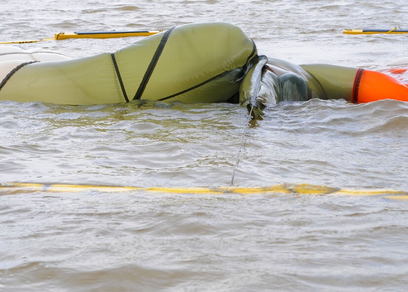 An airman from the 40th Airlift Squadron pulls a parachute over their head Sept. 22, 2011 demonstrating the proper way of escaping parachute entanglement at Fort Phantom Hill in Abilene, Texas. Airmen that have gone through Survival Evasion Resistance Escape training must go through additional training to stay updated and vigilant in case of real world situations. (U.S. Air Force photo by Airman 1st Class Jonathan Stefanko/ Released)