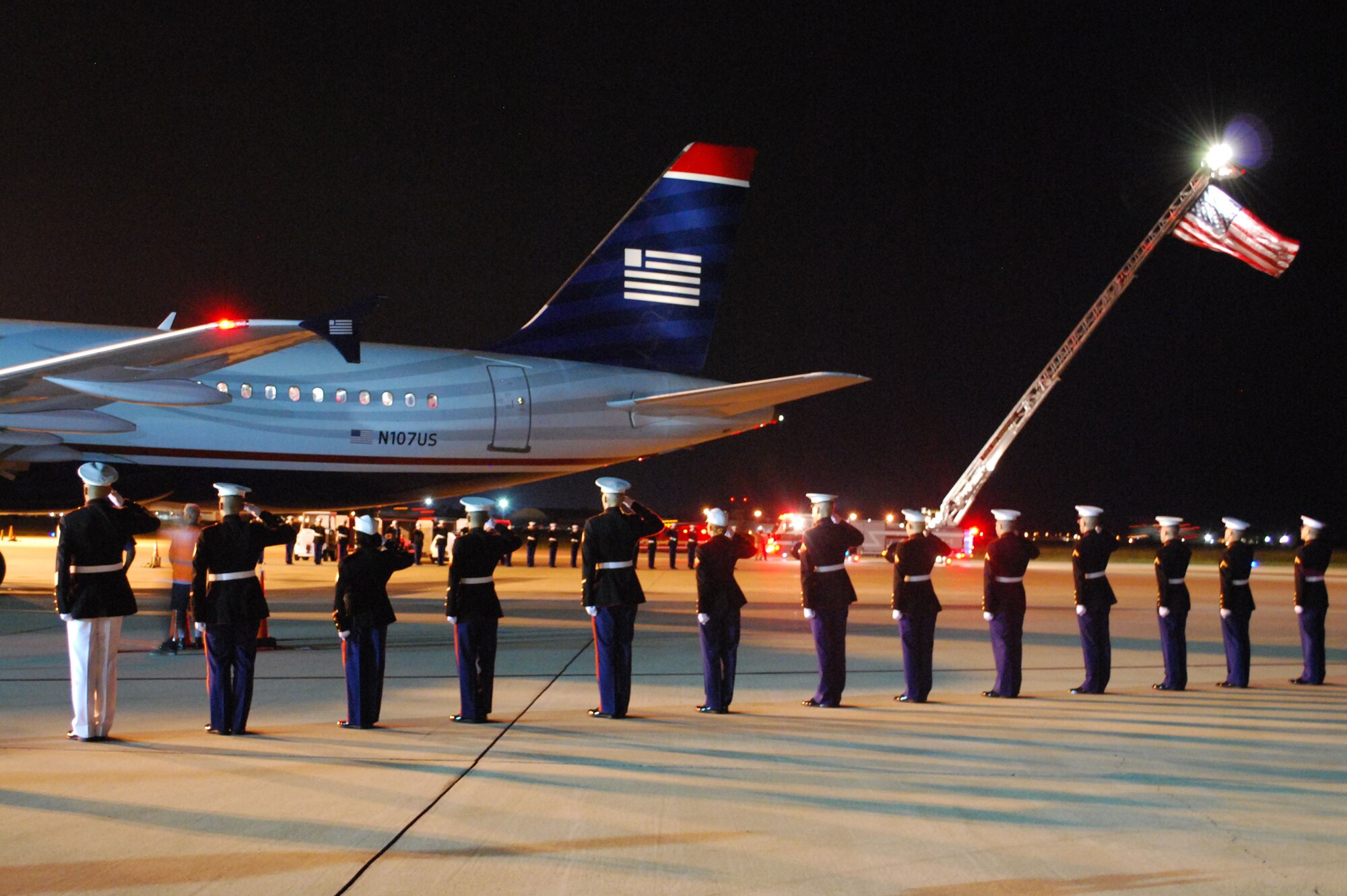 Members of Keesler’s Marine Corps Detachment greet returning members of the Mississippi Gulf Coast’s second Honor Flight Sept. 21 at the Gulfport-Biloxi International Airport.  The 86 World War II veterans visited the World War II Memorial and other Washington, D.C. landmarks and met with Mississippi Sen. Roger Wicker and Rep. Steven Palazzo.  Keesler’s 50-flag team, drum and bugle corps, honor guard and others welcomed the returning veterans.  (Photo by Marine Staff Sgt. Christopher Lambert) 