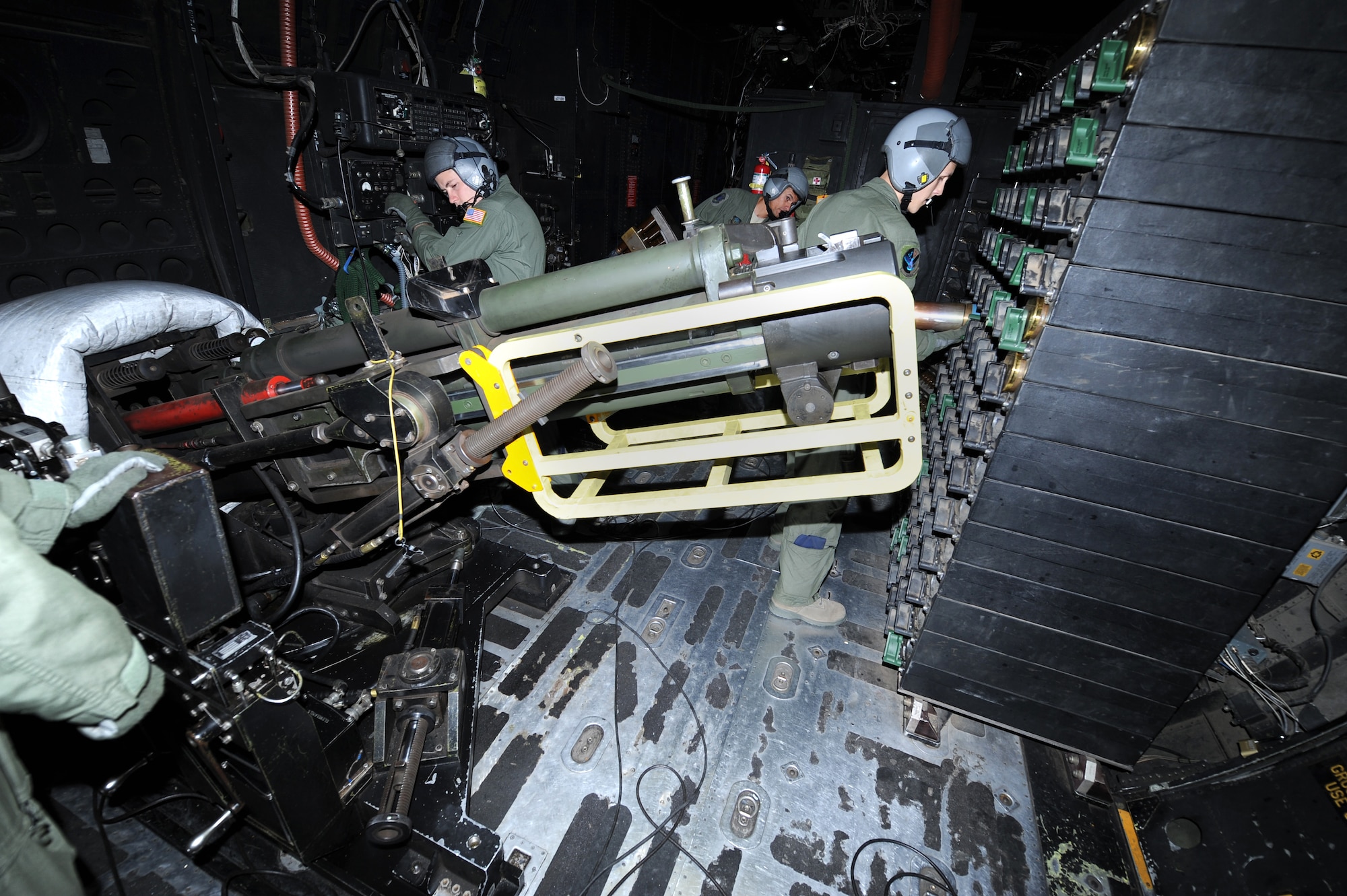 Airman 1st class Dylan Lewark, 16th Special Operations Squadron aerial gunner, unloads a 105mm casing on board an AC-130H Spectre gunship during Operation Dark Night at Melrose Range, N.M., Sept. 22, 2011. This exercise consisted of real life scenarios that could occur in the field. (U.S. Air Force photo by Airman 1st Class Xavier Lockley)