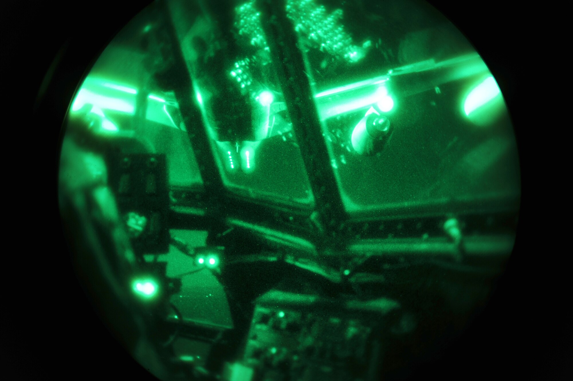 A KC-135 Stratotanker refuels a 16th Special Operations Squadron AC-130H Spectre gunship during Operation Dark Night at Melrose Range, N.M., Sept. 22, 2011.This exercise is used as training for potential threats downrange. (U.S. Air Force photo by Airman 1st Class Xavier Lockley)   