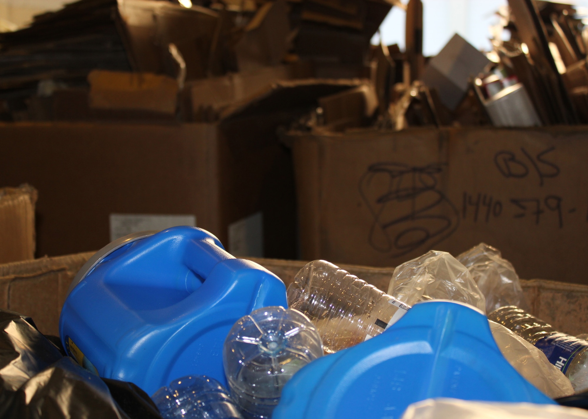 Plastic bottles and containers, cardboard, paper and other post-consumer recyclables are stored in separate bins at the recycling center at Selfridge Air National Guard Base, Mich. Anyone can drop off recyclables including batteries, light bulbs, personal computer equipment and more at the center, located at Bldg. 180, weekdays from 7 a.m. to 4 p.m. (USAF photo by SSgt. Anna-Marie Wyant)