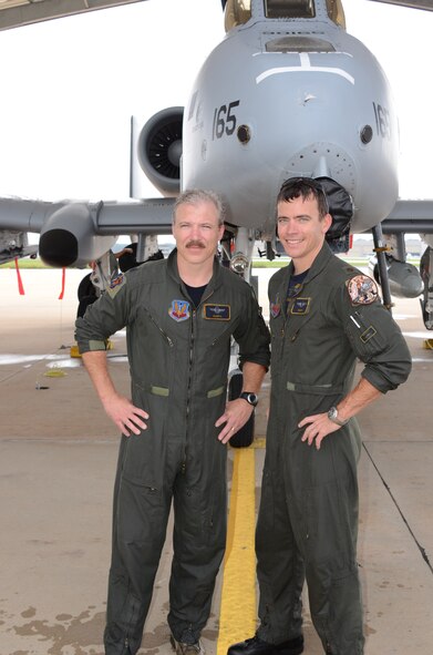 L-R Lt. Col Eric "Murph" Murphy and Major Brian "Snap" Curland, both pilots assigned to the 104th Fighter Squadron, pose for one last photo in front the A-10C after their final flight (fini) at Warfield Air National Guard Base in Baltimore, Md., September 27, 2011.

(U.S. Air Force photo by Master Sgt. Edward B. Bard/Released)  
