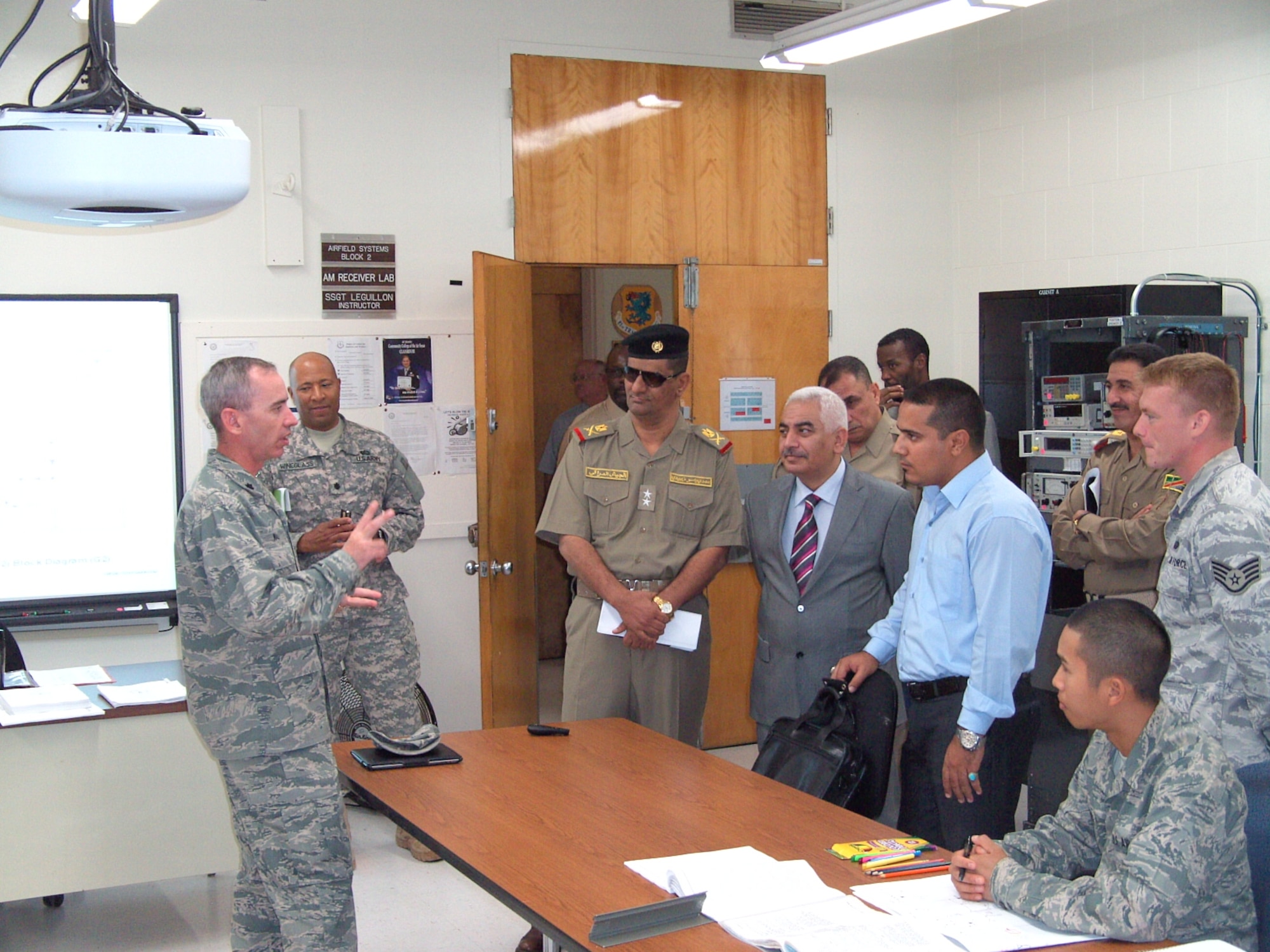 Lt. Col. Trevor Wall, 338th Training Squadron commander, left, answers questions from the Iraqi delegation during the airfield systems training portion of the tour in Jones Hall while Staff Sgt. Shawn Johnson and his students observe.  (U.S. Air Force photo by Capt. Gregory Haney)