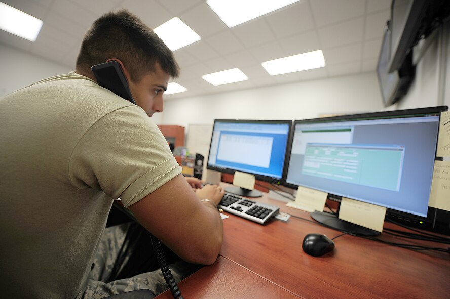 Senior Airman Ross O?Donnell, 4th Communications Squadron Communications Focal Point (CFP) technician, assists a customer in submitting a trouble ticket into the Remedy ticket system for a computer problem on Seymour Johnson Air Force Base, N.C., Sept. 27, 2011. Many bases have 10 to 12 Airmen answering calls and submitting trouble tickets but the CFP on SJAFB only has four. O?Donnell is a native of Fishers, Ind. (U.S. Air Force photo by Senior Airman Rae Perry)