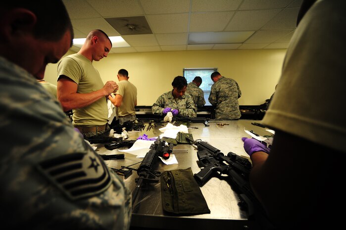 Airmen clean M-4 carbines Sept. 7 at Joint Base Charleston-Air Base, during a Combat Arms Training and Maintenance qualifying course.  (U.S. Air Force photo/Airman 1st Class Matthew Bruch)
