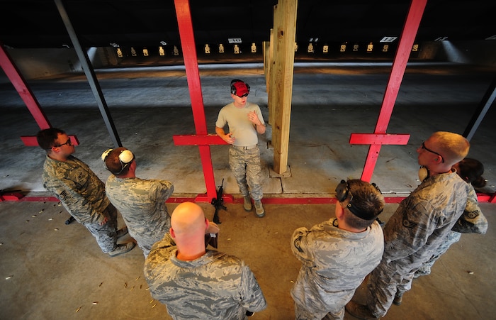 Staff Sgt. Jason Whisenhunt gives advice to students Sept. 7 at Joint Base Charleston-Air Base, during a Combat Arms Training and Maintenance qualifying course. Whisenhunt is a combat arms instructor from the 628th Security Forces Squadron. (U.S. Air Force photo/Airman 1st Class Matthew Bruch)
