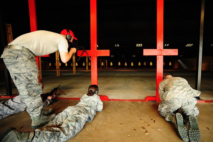 A Combat Arms instructor from the 628th Security Forces Squadron checks the sights on a student’s M-4 carbine Sept. 7 at Joint Base Charleston-Air Base, during a Combat Arms Training and Maintenance qualifying course. (U.S. Air Force photo/Airman 1st Class Matthew  Bruch)

