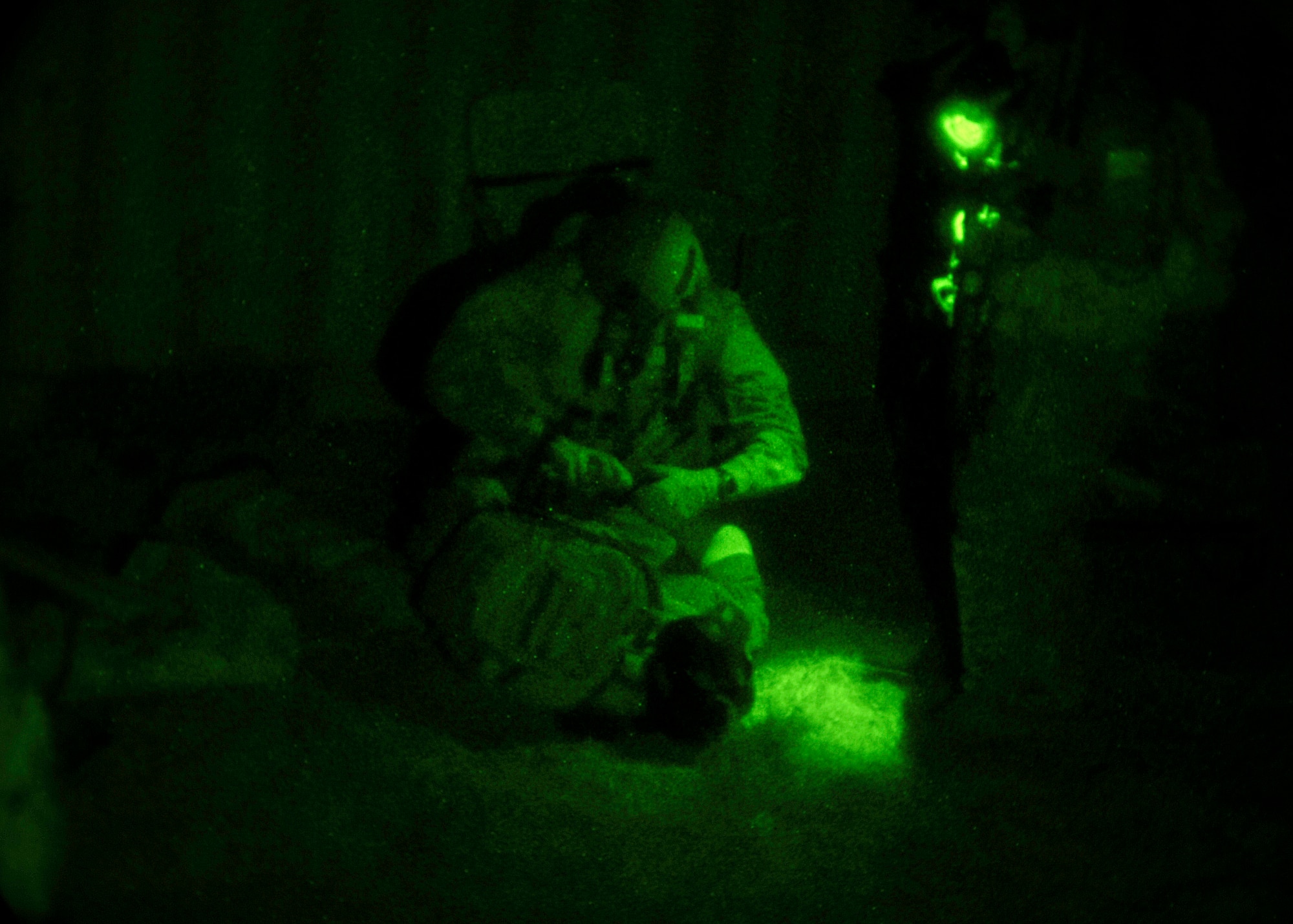 U.S soldiers with the 3rd Special Forces Group, detain a ?terrorist? during an exercise at Melrose Range, N.M., Sept. 22, 2011. The exercise, entitled Operation Dark Night, was designed to prepare the special operators for situations they could encounter on real world missions. (U.S. Air Force photo by Airman 1st Class Ericka Engblom/ Released)