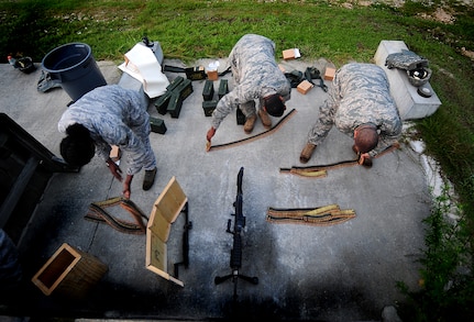 Airmen from the 628th Security Forces Squadron prepare ammunition Aug 31 at Joint Base Charleston-Air Base, during a Combat Arms Training and Maintenance qualifying course.  (U.S. Air Force photo/Airman 1st Class Matthew Bruch)
