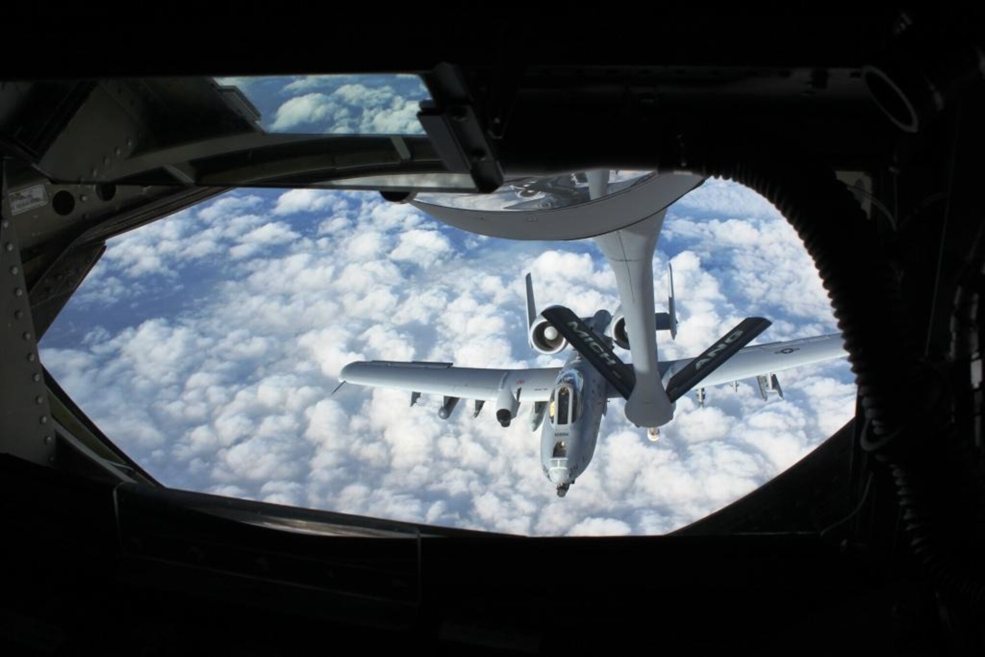 An A-10 Thunderbolt II moves in to position to receive fuel from a KC-135 Stratotanker somewhere over the northeastern United States, Sept. 26, 2011. The A-10 is flown by a pilot from the 107th Fighter Squadron, which was traveling to a deployment in Afghanistan. The KC-135 was flown by a crew from the 171st Air Refueling Squadron. Both squadrons are part of the Michigan Air National  Guard and are assigned to Selfridge Air National Guard Base, Mich. (U.S. Air Force photo by TSgt. Dan Heaton)