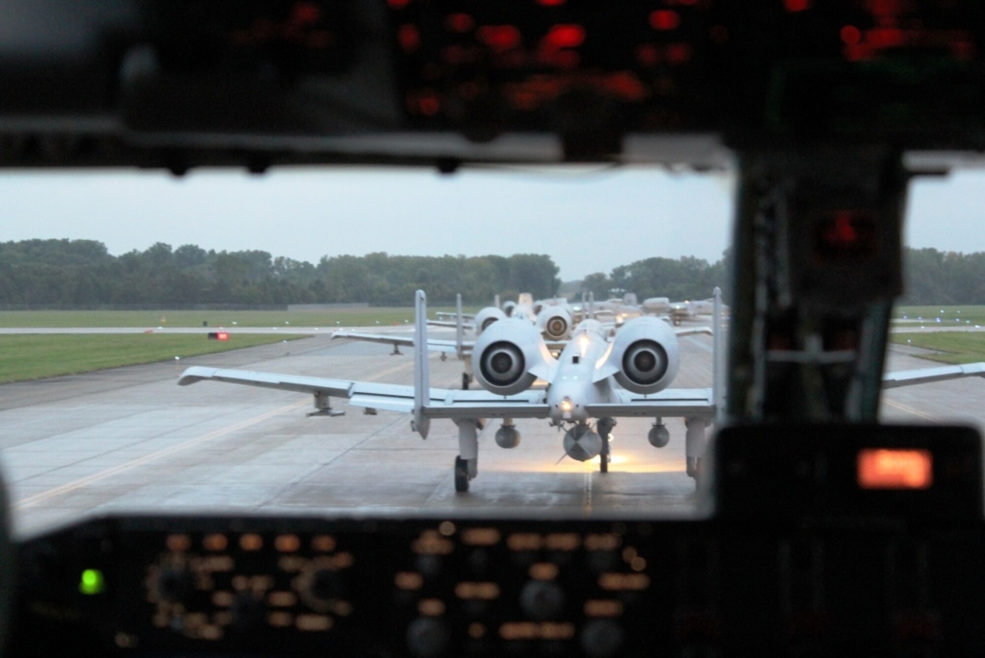 Seen from onboard the flight deck of a KC-135 Stratotanker, a group of A-10 Thunderbolt II aircraft prepare to take off from Selfridge Air National Guard Base, Mich., Sept. 26, 2011. The A-10s were deploying to Afghanistan from Selfridge. The KC-135 provided in-flight refueling support to the A-10s. Both aircraft are operated and maintained by Airmen of the 127th Wing of the Michigan Air National Guard assigned to Selfridge. (U.S. Air Force photo by TSgt. Dan Heaton)