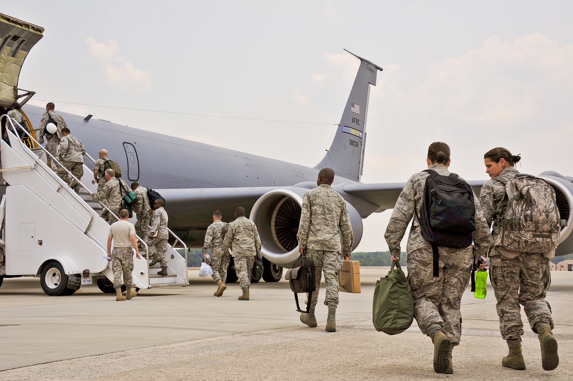 Members from the 116th Civil Engineering Squadron, Robins Air Force Base, Ga., board a KC-135 Stratotanker bound for Gallop, N.M., June 5, 2011.  The squadron deployed for training to Window Rock, Ariz. where they worked on a construction project for St. Michaels Association for Special Education on the Navajo Nation reservation.(U.S. Air Force photo by Master Sgt. Roger Parsons/Released)