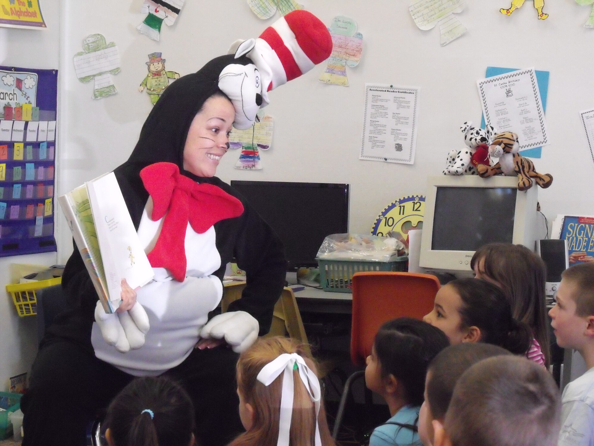 Amy Adams, Balfour Beatty LifeWorks coordinator, reads “Oh! The Places You’ll GO!” March 31, 2010 to Scandia School’s Second Grade Class for Dr. Suess’ Birthday. (courtesy photo)