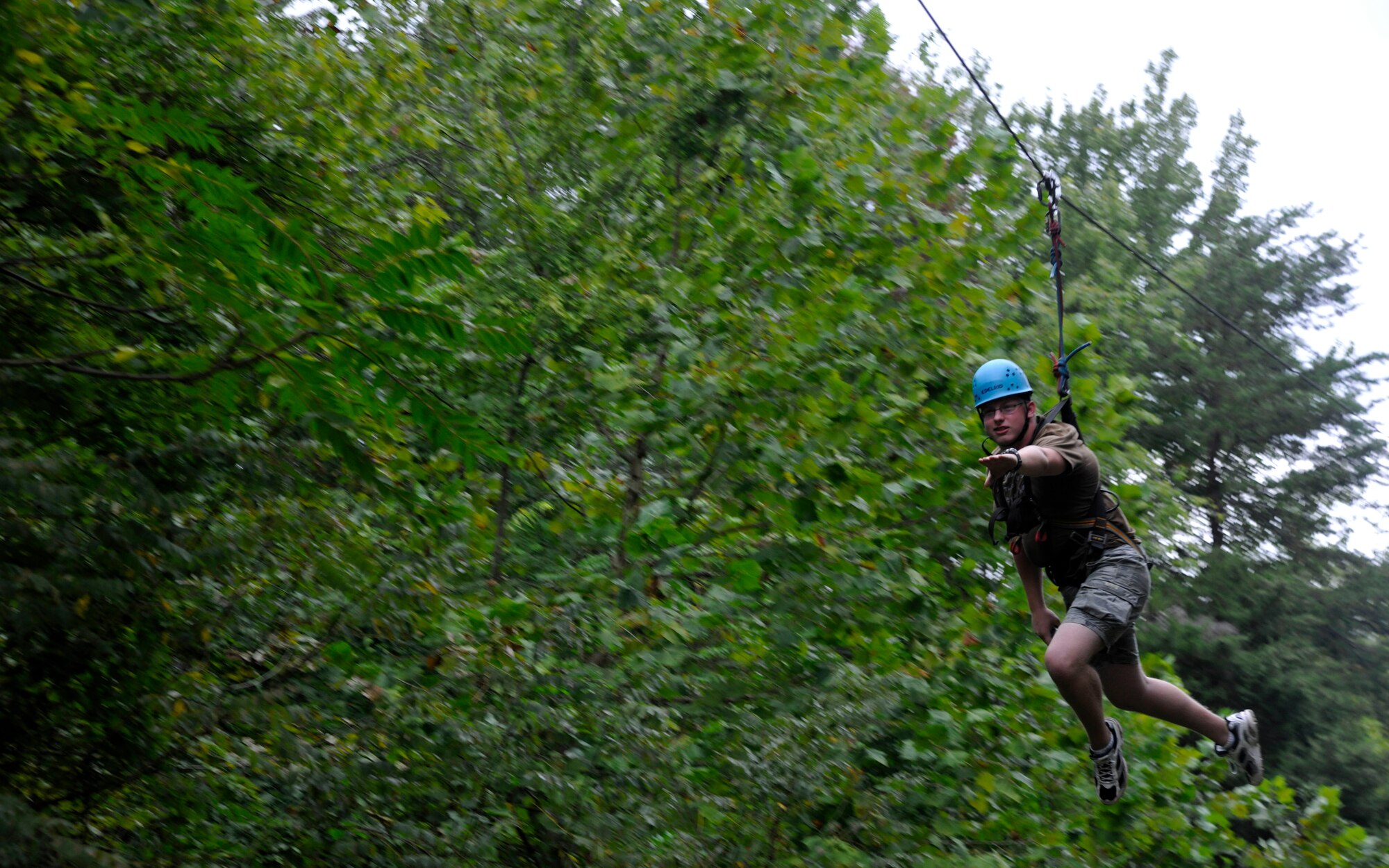Airman 1st Class Kasey Roy, 779 Medical Support Squadron biomedical equiptment technician, soars through Appalachian Mountain air during a zip-lining JBA Chapel Wilderness Retreat activity Sept. 22. For the more than 30 Airmen from Joint Base Andrews and Joint Base Anacostia-Bolling who attended the retreat, zip-lining was the highlight of their week-long, confidence-building activities. (U.S. Air Force photo/Airman 1st Class Lindsey A. Beadle)