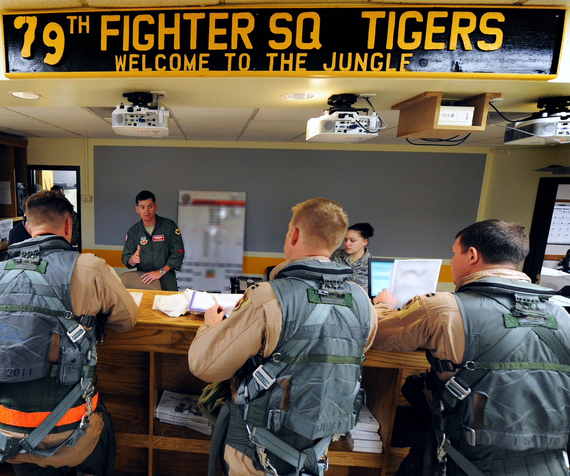 U.S. Air Force Lt. Col. Matthew Cliver, 77th Fighter Squadron director of operations, gives the 79th Fighter Squadron F-16 Fighting Falcon pilots their pre-departure briefing before takeoff, Shaw Air Force Base, S.C., Sept. 24, 2011. Eighteen 79th Fighter Squadron F-16 Fighting Falcon aircraft deployed in support of Operation Unified Protector. (U.S. Air Force photo by Airman 1st Class Tabatha Duarte/Released)
