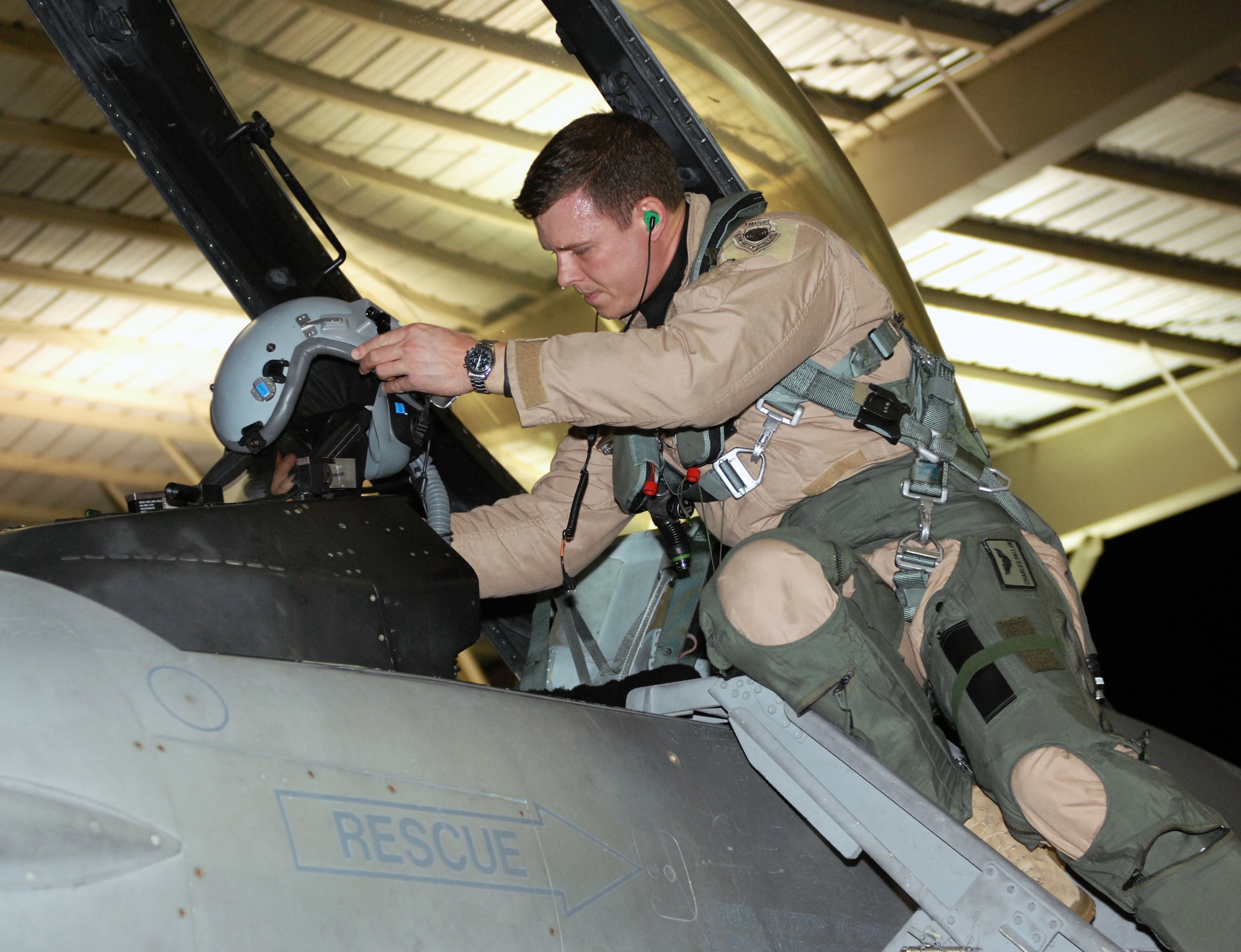 U.S. Air Force Capt. Charles Fallon, 79th Fighting Squadron F-16 Fighting Falcon pilot, checks aircraft and equipment as part of a pre-departure requirement, Shaw Air Force Base, S.C., Sept. 24, 2011. Eighteen 79th Fighter Squadron F-16 Fighting Falcon aircraft deployed in support of Operation Unified Protector. (U.S. Air Force photo by Airman 1st Class Tabatha Duarte/Released)