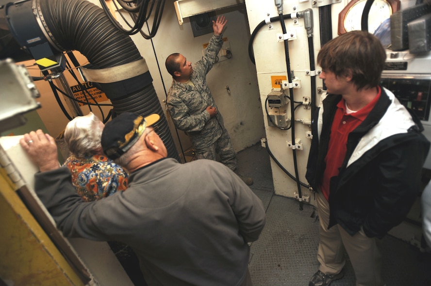 MINOT AIR FORCE BASE, N.D. -- Tech. Sgt. Javier Martinez, 91st Maintenance Operations Squadron electronics lab technician, conducts a tour of a missile silo here as part of Retiree Day Sept. 23. The event included a tour of a B-52H Stratofortress and an informational fair which showcased a variety of base agencies and local offices such as the North Dakota Military and Family Outreach. (U.S. Air Force Photo/Airman 1st Class Jose L. Hernandez)