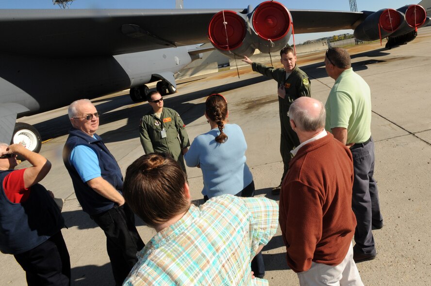 MINOT AIR FORCE BASE, N.D. -- A B-52H Stratofortress crew briefs tour members on the buff’s capabilities and its history as part of Retiree Day here Sept. 23. The event included a missile silo tour and an informational fair which showcased a variety of base agencies and local offices such as the North Dakota Military and Family Outreach. (U.S. Air Force Photo/Airman 1st Class Jose L. Hernandez)