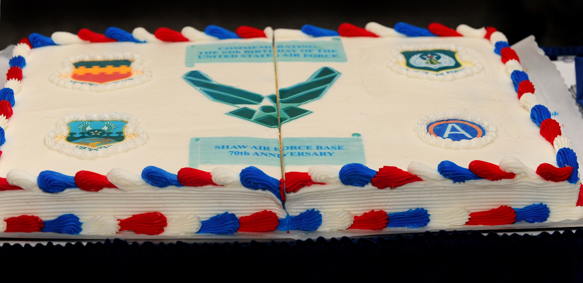 Team Shaw celebrated with birthday cake during the 70th Anniversary of Shaw Field and the 64th birthday of the Air Force, Sept. 23, 2011, Shaw Air Force Base, S.C. More than 200 Team Shaw and Sumter area members gathered at the Carolina Skies Club to celebrate. (U.S. Air Force photo by Airman 1st Class Ashley Gardner/Released)



